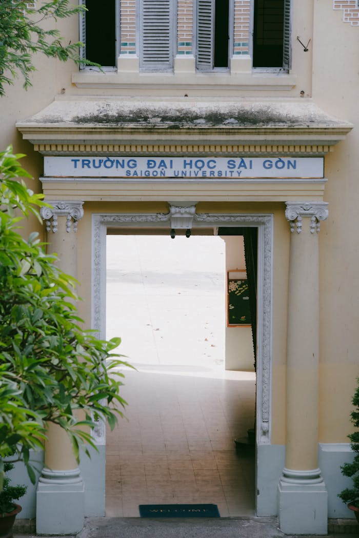 The entrance of Saigon University in Ho Chi Minh City, Vietnam, featuring classical architecture.